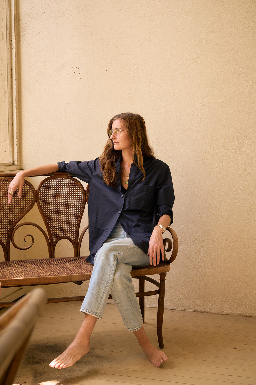 image of erin reitz sitting in a chair wearing a offered products